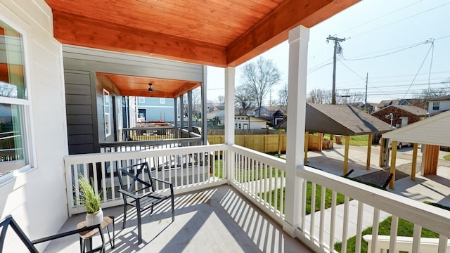 exterior space with covered porch and a residential view