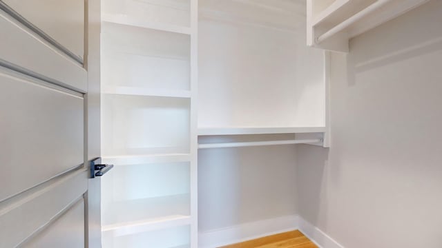 walk in closet featuring light wood-style floors