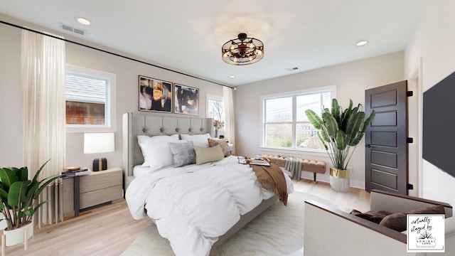 bedroom featuring radiator, recessed lighting, visible vents, and light wood-style floors