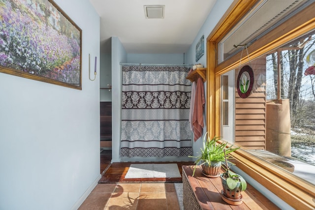 interior space featuring baseboards