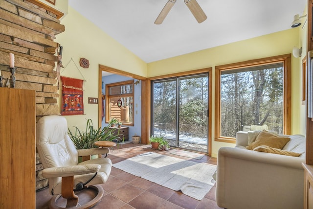 sunroom / solarium with vaulted ceiling and a ceiling fan