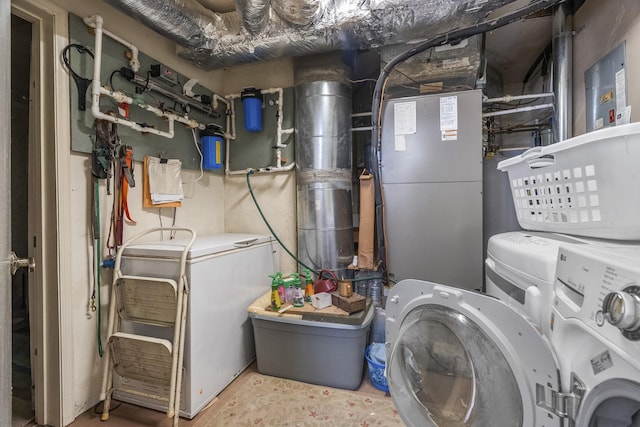 utility room with independent washer and dryer