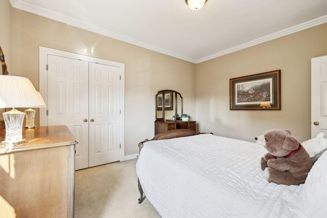 bedroom with light carpet, a closet, baseboards, and crown molding