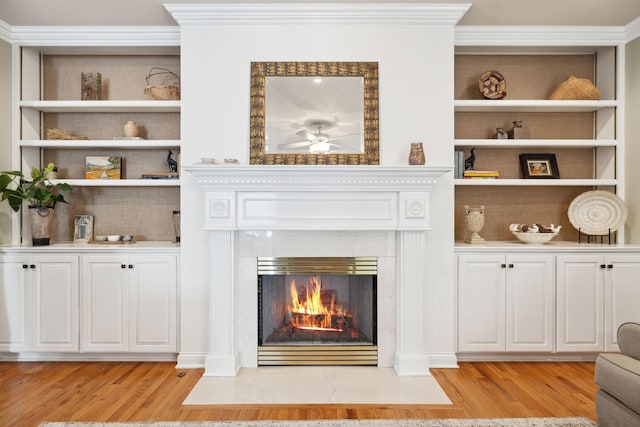 details featuring ornamental molding and wood finished floors