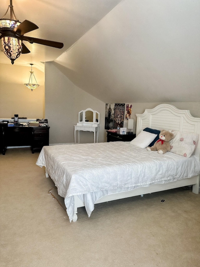bedroom with light carpet and lofted ceiling