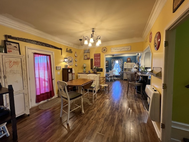 dining room featuring ornamental molding, an inviting chandelier, dark wood finished floors, and heating unit