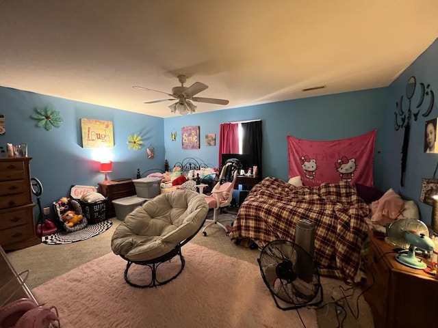 bedroom with carpet floors, visible vents, and a ceiling fan