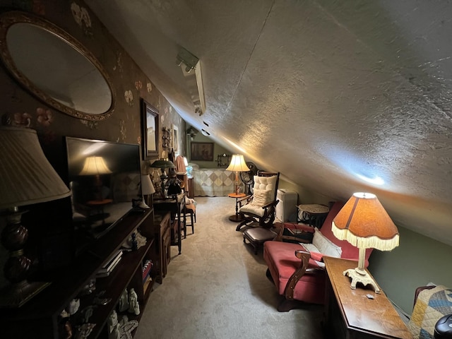 sitting room featuring carpet floors, a textured ceiling, and lofted ceiling