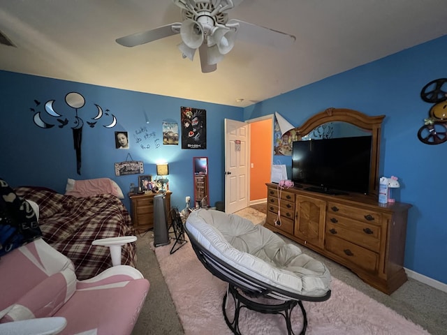 bedroom featuring carpet floors, baseboards, and a ceiling fan