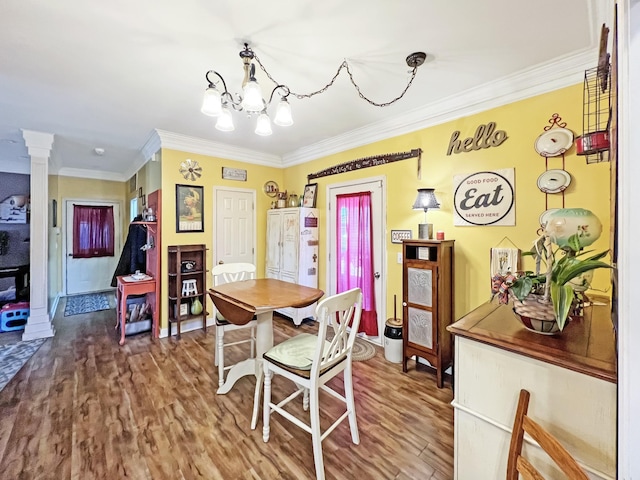 325 Davis Mill Rd, Elkton, KY 42220 - dining room with wood finished floors, crown molding, a chandelier, and ornate columns