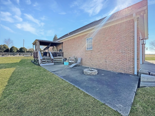 325 Davis Mill Rd, Elkton, KY 42220 - view of property exterior with a yard, brick siding, and a patio