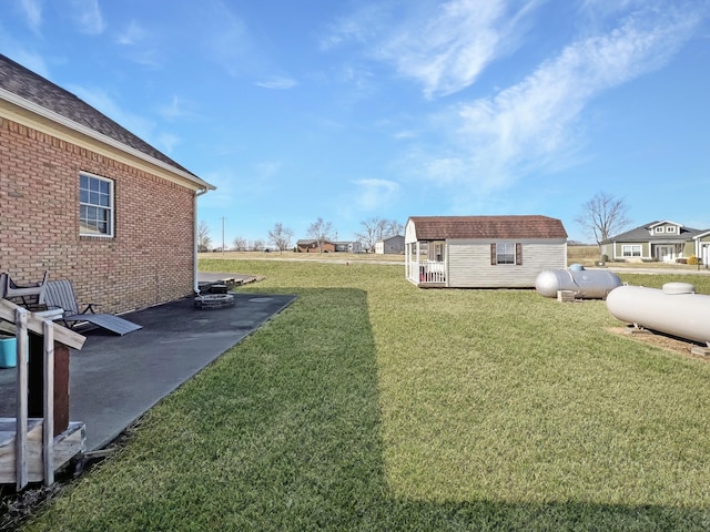 325 Davis Mill Rd, Elkton, KY 42220 - view of grassy yard featuring an outbuilding and a patio area