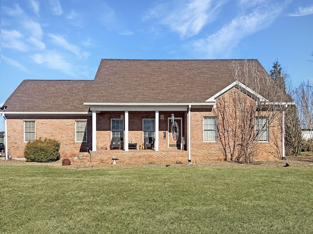 325 Davis Mill Rd, Elkton, KY 42220 - view of front of home with a front yard, brick siding, and roof with shingles