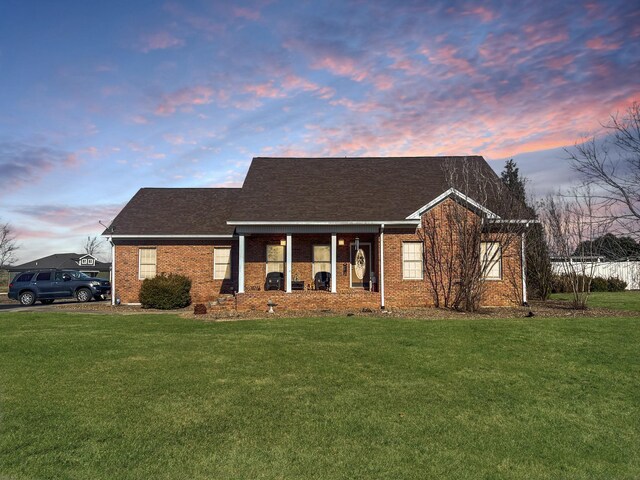 325 Davis Mill Rd, Elkton, KY 42220 - view of front of property featuring a front yard, brick siding, and roof with shingles