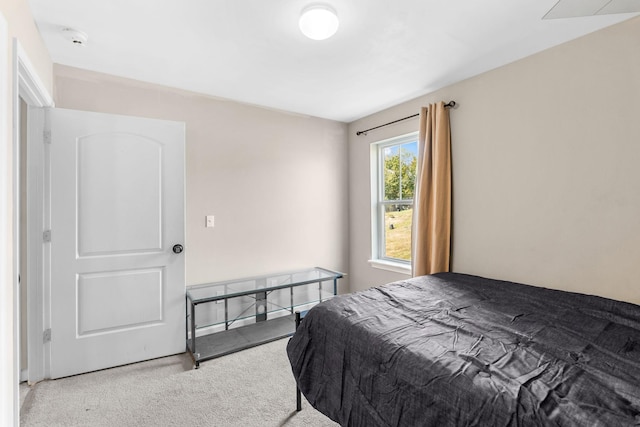 bedroom with light colored carpet