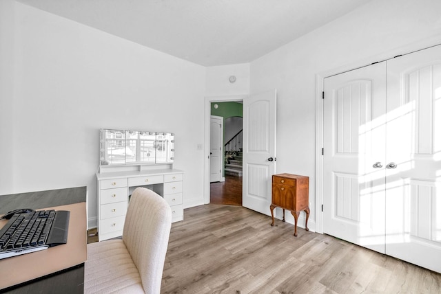 home office with light wood finished floors