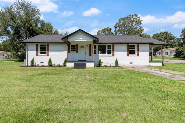 ranch-style house featuring brick siding, roof with shingles, crawl space, a carport, and a front yard