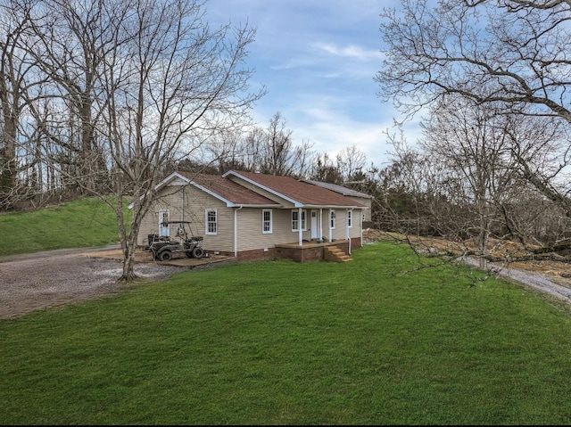 exterior space featuring driveway and a front yard