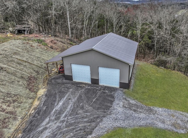 224 Kempville Hwy, Carthage, TN 37030 - garage featuring a garage and a forest view
