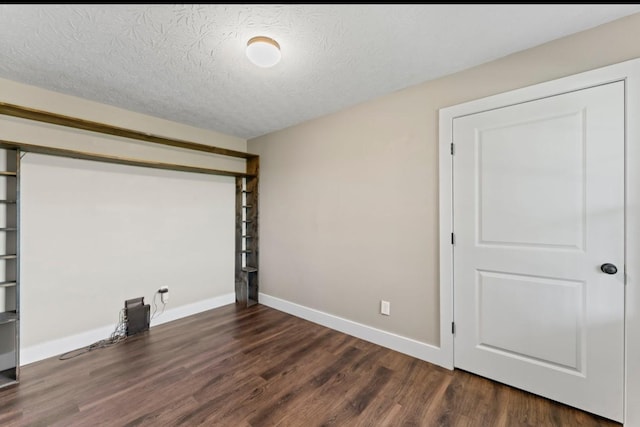 224 Kempville Hwy, Carthage, TN 37030 - empty room with baseboards, dark wood finished floors, and a textured ceiling