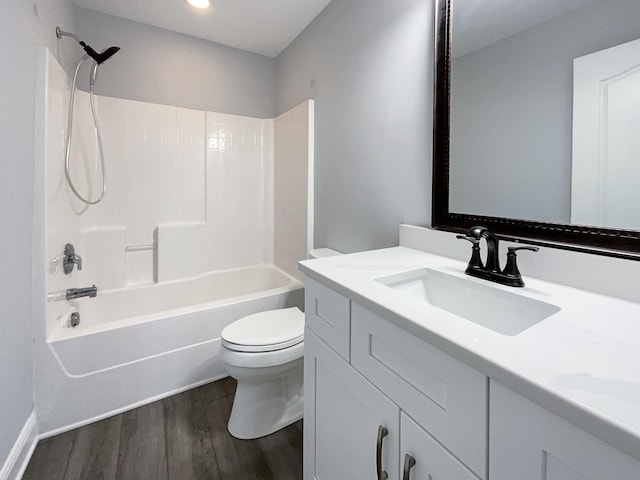 full bathroom featuring vanity, bathing tub / shower combination, toilet, and wood finished floors