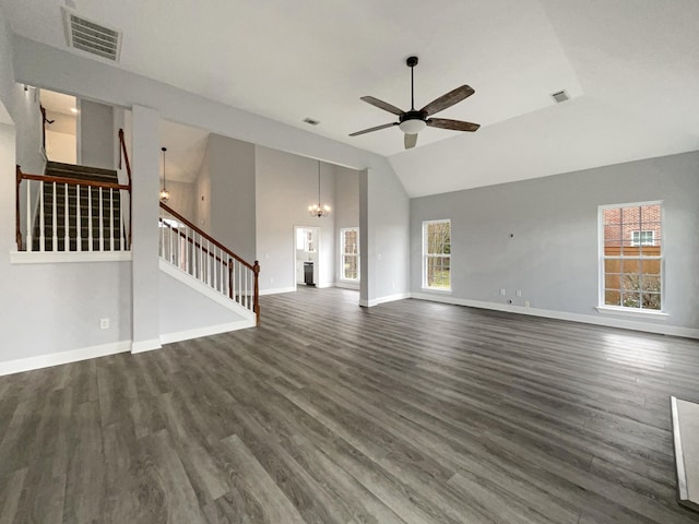 unfurnished living room featuring dark wood finished floors, visible vents, stairway, baseboards, and ceiling fan with notable chandelier