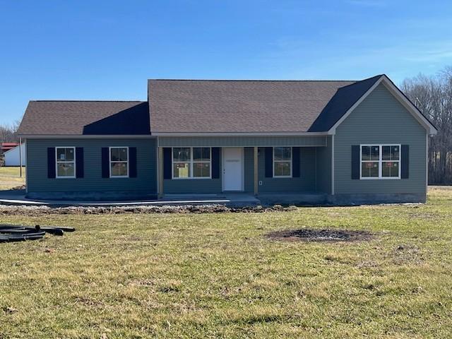 single story home with a porch and a front yard