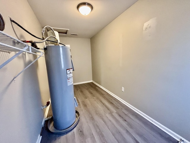 utility room with water heater