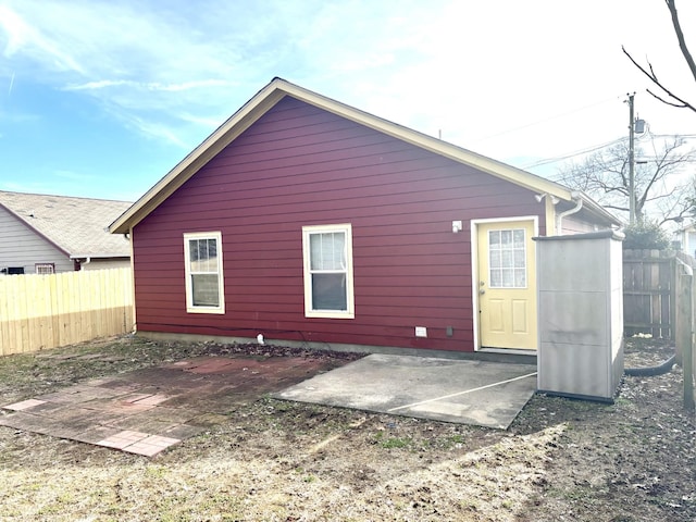 back of house with a patio area and fence