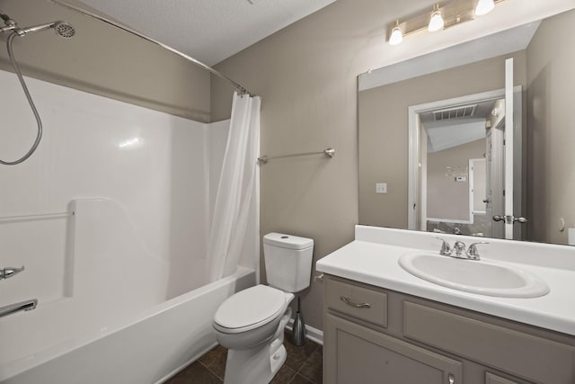 bathroom with toilet, shower / tub combo with curtain, tile patterned flooring, a textured ceiling, and vanity