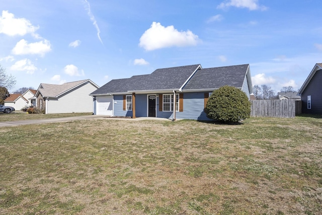 ranch-style home featuring a garage, driveway, a front lawn, and fence