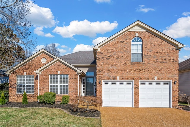 view of front facade with driveway, brick siding, and an attached garage