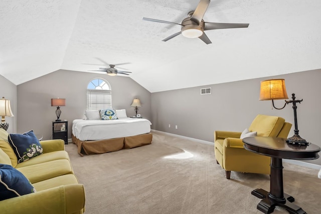 bedroom with baseboards, visible vents, carpet, vaulted ceiling, and a textured ceiling