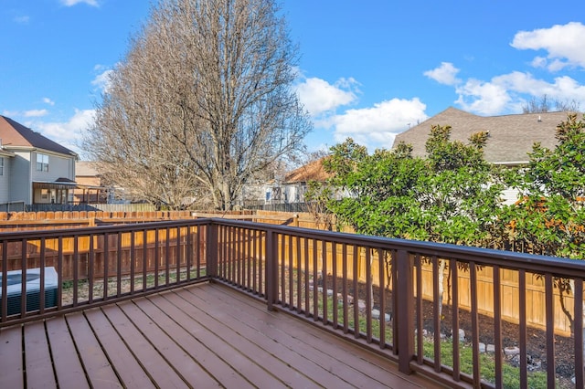 deck featuring a residential view, a fenced backyard, and central air condition unit