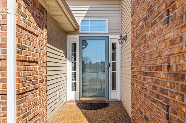 entrance to property with brick siding