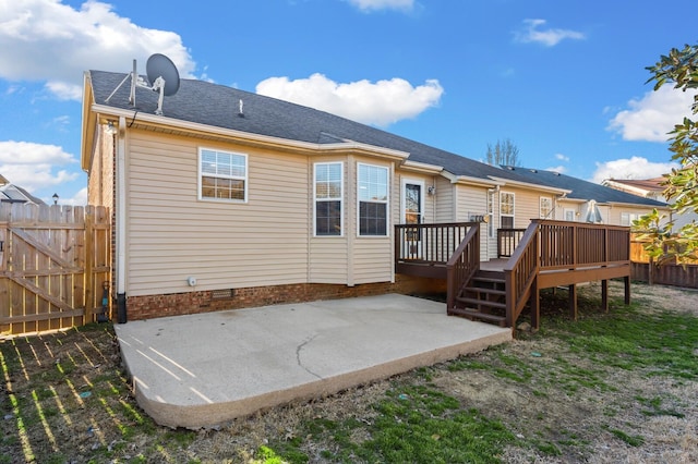 back of house with a patio, crawl space, a gate, fence, and a wooden deck