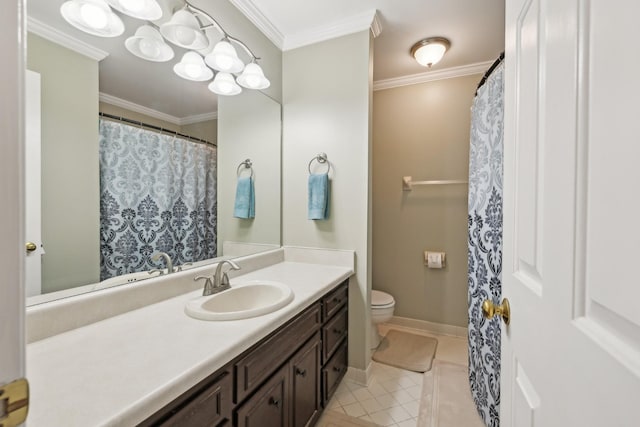 bathroom with crown molding, toilet, vanity, baseboards, and tile patterned floors