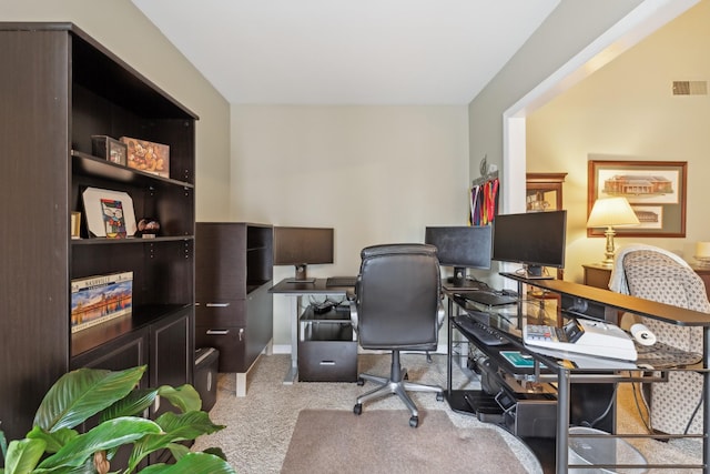 home office with light colored carpet and visible vents