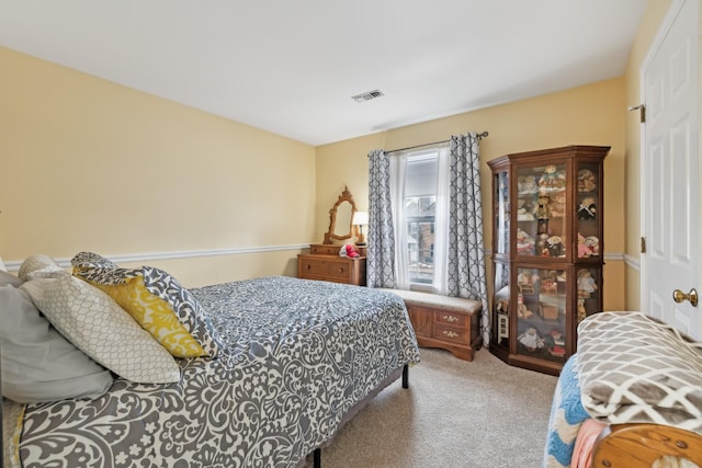 bedroom featuring visible vents and carpet flooring