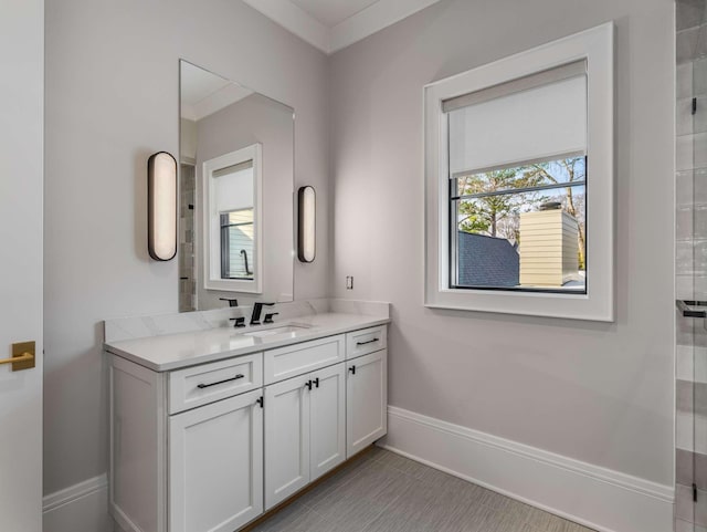 bathroom featuring vanity and baseboards