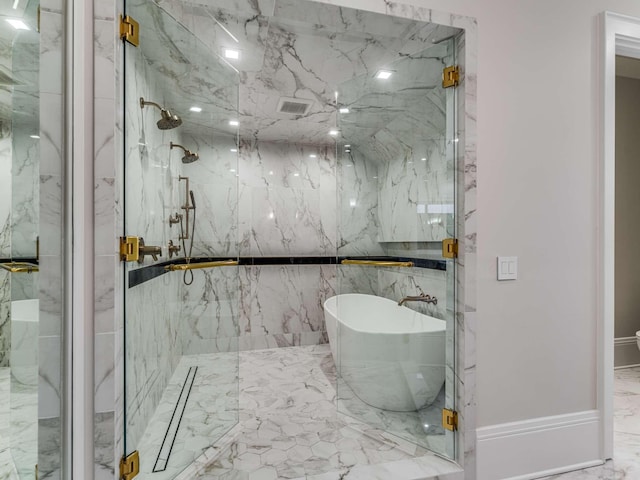 bathroom featuring marble finish floor, a soaking tub, a marble finish shower, and visible vents