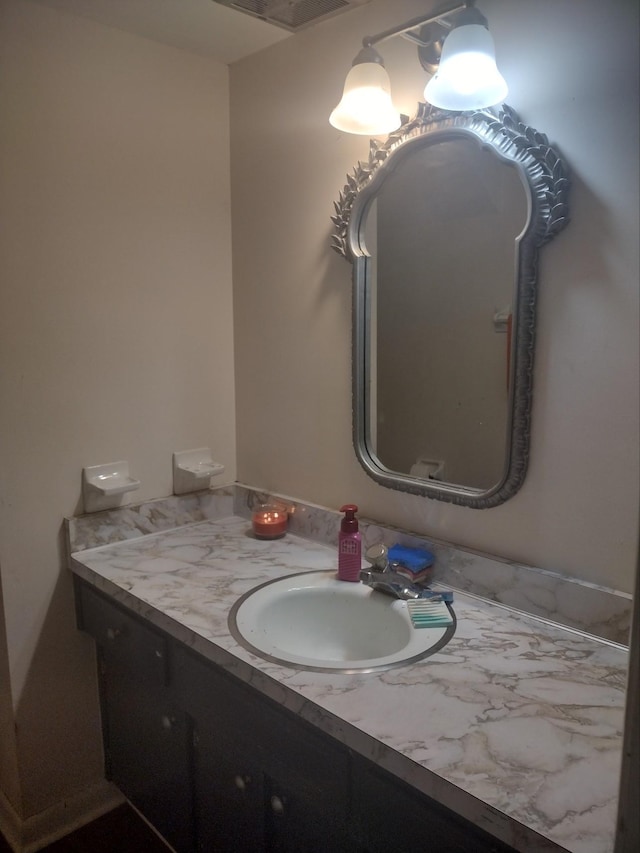 bathroom with visible vents and vanity