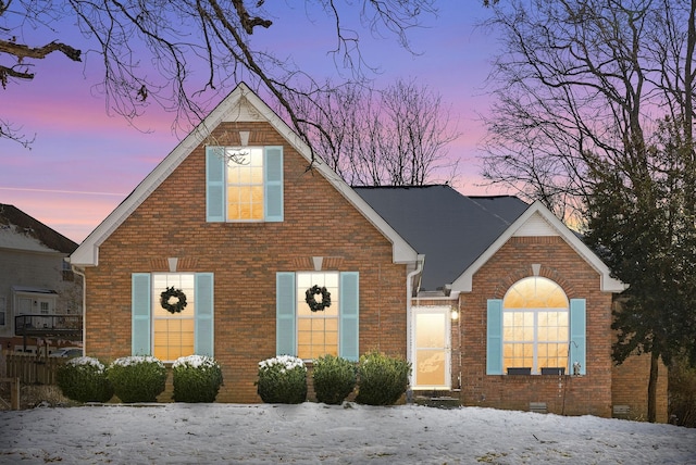 traditional home featuring crawl space and brick siding