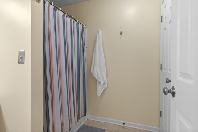 bathroom with baseboards