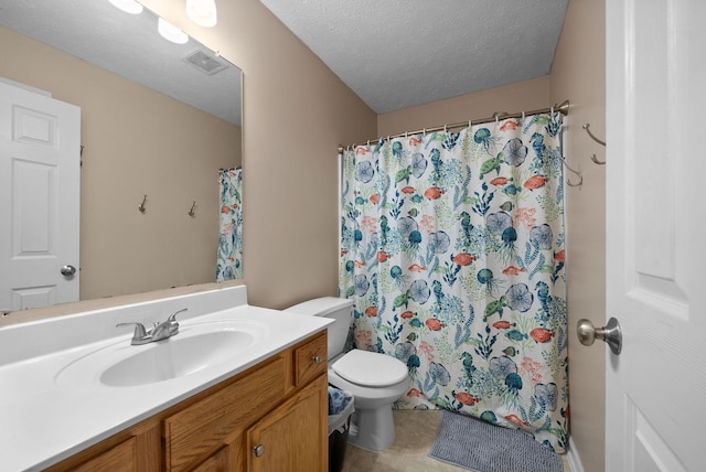 bathroom with curtained shower, toilet, vanity, and a textured ceiling