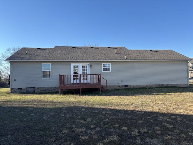 rear view of house featuring a deck, a shingled roof, crawl space, and a lawn