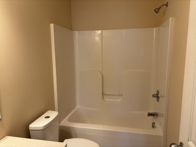 full bath featuring toilet and shower / washtub combination