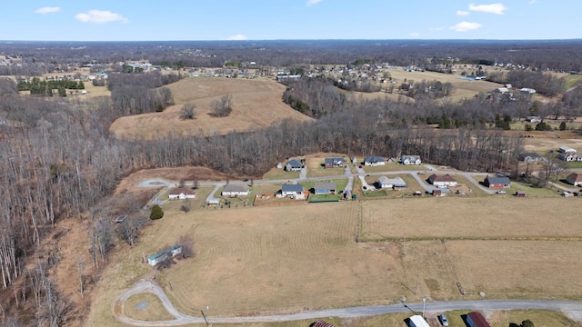 birds eye view of property featuring a rural view