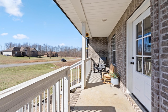 balcony featuring a porch and a residential view