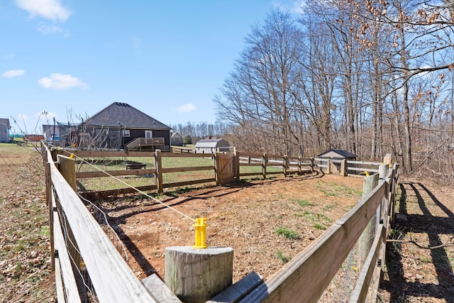 view of yard with a rural view and fence